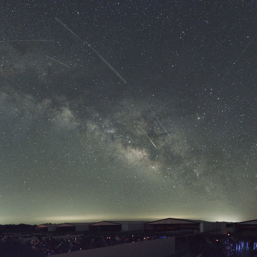 The Milky Way with visible meteor and satellite streaks over Starfront Observatories